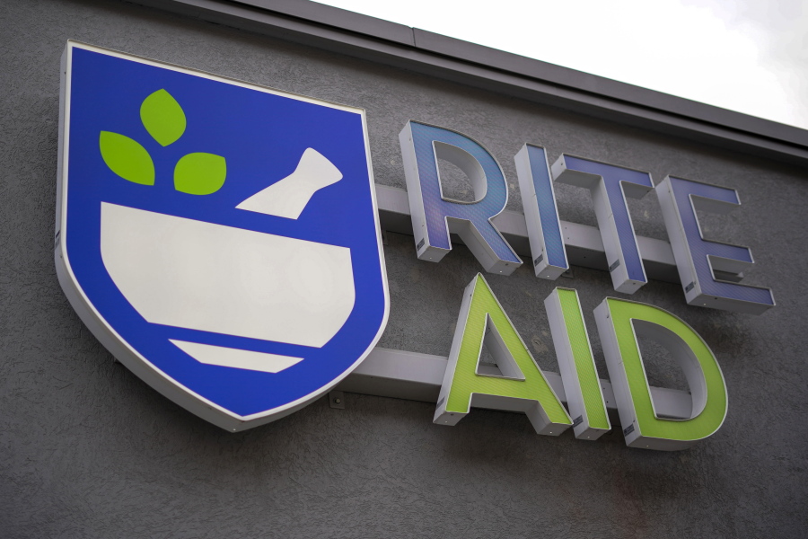 FILE - A Rite Aid logo is displayed on its store in Pittsburgh, on Jan. 12, 2022. Rite Aid is limiting how many emergency contraceptives consumers can buy, joining other retailers who put in place similar caps following the Supreme Court decision overruling Roe v. Wade. The policy went into effect Monday, June 27, at the drugstore chain, which has limited the purchase of Plan B pills to three units per customer due to increased demand, a company spokesperson said. (AP Photo/Gene J.