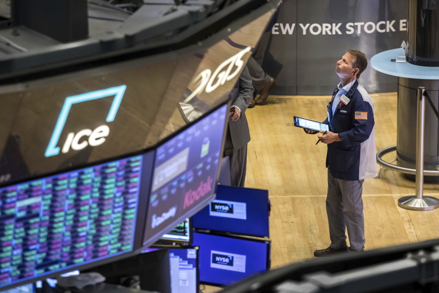 In this photo provided by the New York Stock Exchange, trader Robert Charmak works on the floor, Wednesday, June 1, 2022. Stocks were moderately lower in midday trading Wednesday after a stronger-than-expected report on manufacturing showed that it's likely the Federal Reserve will continue to aggressively raise interest rates to slow down the economy and tame inflation.