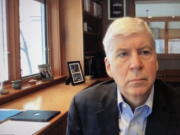 FILE - This screen shot from video, shows former Michigan Gov. Rick Snyder, during his Zoom hearing in the 67th District Court in Flint, Mich., on Jan. 18, 2020. A judge had no authority to issue indictments in the Flint water scandal, the Michigan Supreme Court said Tuesday, June 28, 2022 in an extraordinary decision that wipes out charges against former Gov.