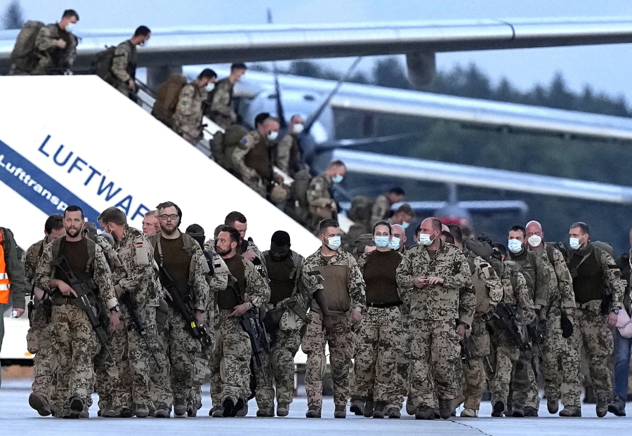 File---File photo shows German soldiers arriving on a plane from Tashkent, Uzbekistan at the Bundeswehr airbase in Wunstorf, Germany, Friday, Aug. 27, 2021, after they finished the evacuation mission in Kabul, Afghanistan.