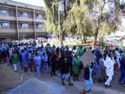 FILE -Health workers led by nurses take part in a demonstration over salaries at Parerenyatwa Hospital in Harare, on June, 21, 2022. As food costs and fuel bills soar, inflation is plundering people's wallets, sparking a wave of protests and workers' strikes around the world.