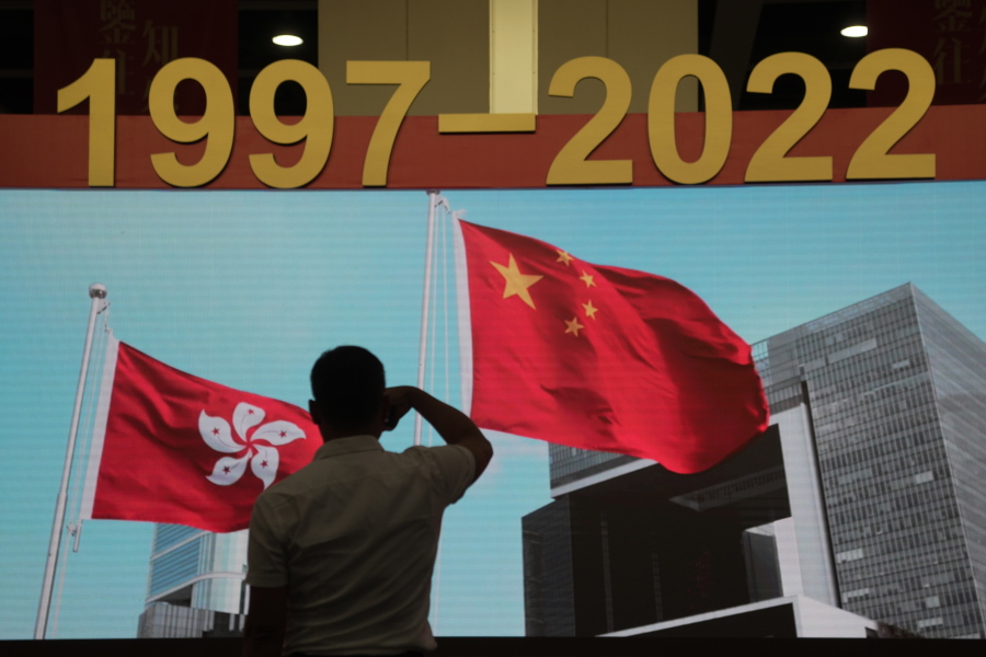 A man tours an exhibition to mark the 25th anniversary of the former British colony's return to Chinese rule, in Hong Kong, Friday, June 24, 2022. Hong Kong authorities, citing "security reasons," have barred more than 10 journalists from covering events and ceremonies this week marking the 25th anniversary of Hong Kong's return to China, according to the Hong Kong Journalists Association.