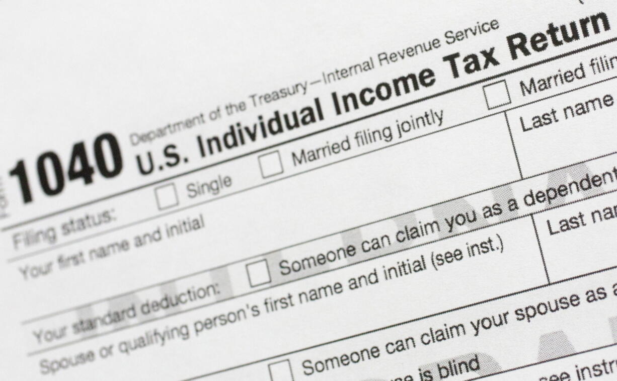 FILE - A portion of the 1040 U.S. Individual Income Tax Return form is shown July 24, 2018, in New York. The IRS said Tuesday, June 21, 2022, that it will have erased its backlog of last season's tax returns by the end of this week.