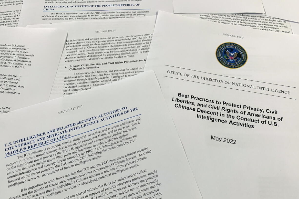A report issued by the Office of the Director of National Intelligence is photographed in Washington, June 14, 2022. As America's intelligence agencies ramp up efforts against China, top officials acknowledge they may also end up collecting more phone calls and emails from Chinese Americans, raising new concerns about spying affecting civil liberties. The new report makes several recommendations, from expanding unconscious bias training to reiterating internally that federal law bans targeting someone solely due to their ethnicity.