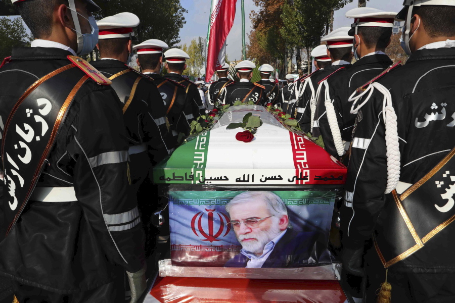 FILE - In this photo released by the official website of the Iranian Defense Ministry, military personnel stand near the flag-draped coffin of Mohsen Fakhrizadeh, a scientist who was killed on Friday, during a funeral ceremony in Tehran, Iran, Monday, Nov. 30, 2020. A court in Iran on Thursday, June 23, 2022 ordered the United States government to pay over $4 billion to the families of Iranian nuclear scientists who have been killed in targeted attacks in recent years, state-run media reported.