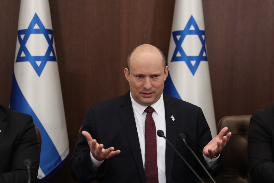FILE - Israeli Prime Minister Naftali Bennett attends a cabinet meeting at the Prime Minister's office in Jerusalem, Sunday, June 19, 2022. Bennett's office announced Monday, June 20, 2022, that his weakened coalition will be disbanded and the country will head to new elections. Bennett has struggled to keep his unruly coalition of eight parties together, and defections have left the crumbling alliance without a majority in parliament for over two months.