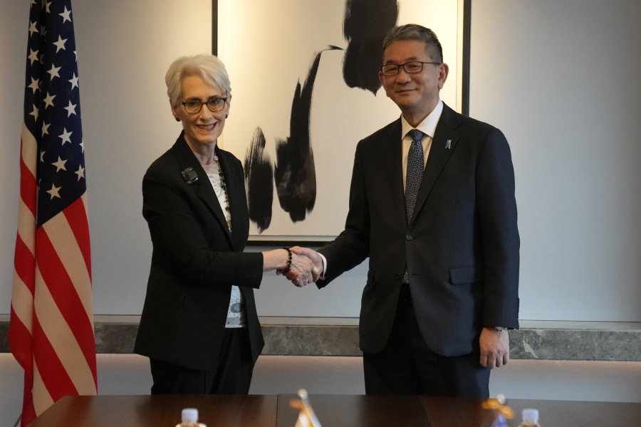 U.S. Deputy Secretary of State Wendy Sherman, left, and Japanese Vice Minister for Foreign Affairs Takeo Mori, right, shake hands for the media before their meeting in Seoul, South Korea, Wednesday, June 8, 2022. U.S. Deputy Secretary of State Wendy Sherman met with her counterparts from South Korea and Japan on Wednesday, emphasizing the U.S. commitment to defend its allies and trilateral security cooperation to confront an accelerating nuclear threat from North Korea.