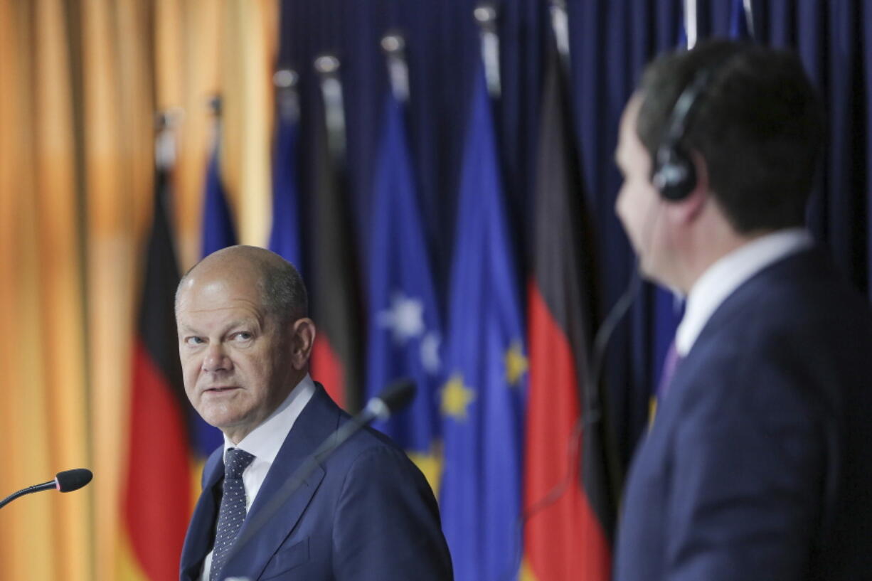 German Chancellor Olaf Scholz, left, and Kosovo Prime Minister Albin Kurti attend a joint press conference in Kosovo capital Pristina on Friday, June 10, 2022. Scholz is on a one day visit to the country.