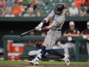 Seattle Mariners' Jesse Winker connects for an RBI single to score Taylor Trammell during the third inning of a baseball game against the Baltimore Orioles, Thursday, June 2, 2022, in Baltimore.