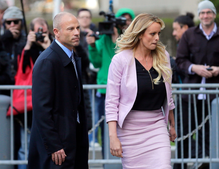FILE - In this April 16, 2018 file photo, Stormy Daniels, right, and her attorney Michael Avenatti turn from the microphones after speaking as they leave federal court in New York. California lawyer Michael Avenatti wants leniency at sentencing for defrauding former client Stormy Daniels of hundreds of thousands of dollars, his lawyers say, citing a letter in which he told Daniels: "I am truly sorry." The emailed letter, dated May 13, was included in a submission his lawyers made late Thursday, May 19, 022, in Manhattan federal court in advance of a June 2 sentencing.