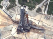 This satellite image provided by Maxar Technologies shows NASA's Space Launch System (SLS) rocket and and the Orion space capsule on the launch pad at Launch Complex 39B at the Kennedy Space Center in Florida on Saturday, June 18, 2022.