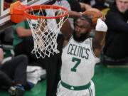 Boston Celtics guard Jaylen Brown (7) dunks the ball against the Golden State Warriors during the second quarter of Game 3 of basketball's NBA Finals, Wednesday, June 8, 2022, in Boston.