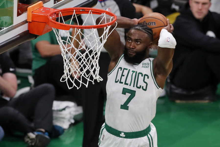 Boston Celtics guard Jaylen Brown (7) dunks the ball against the Golden State Warriors during the second quarter of Game 3 of basketball's NBA Finals, Wednesday, June 8, 2022, in Boston.