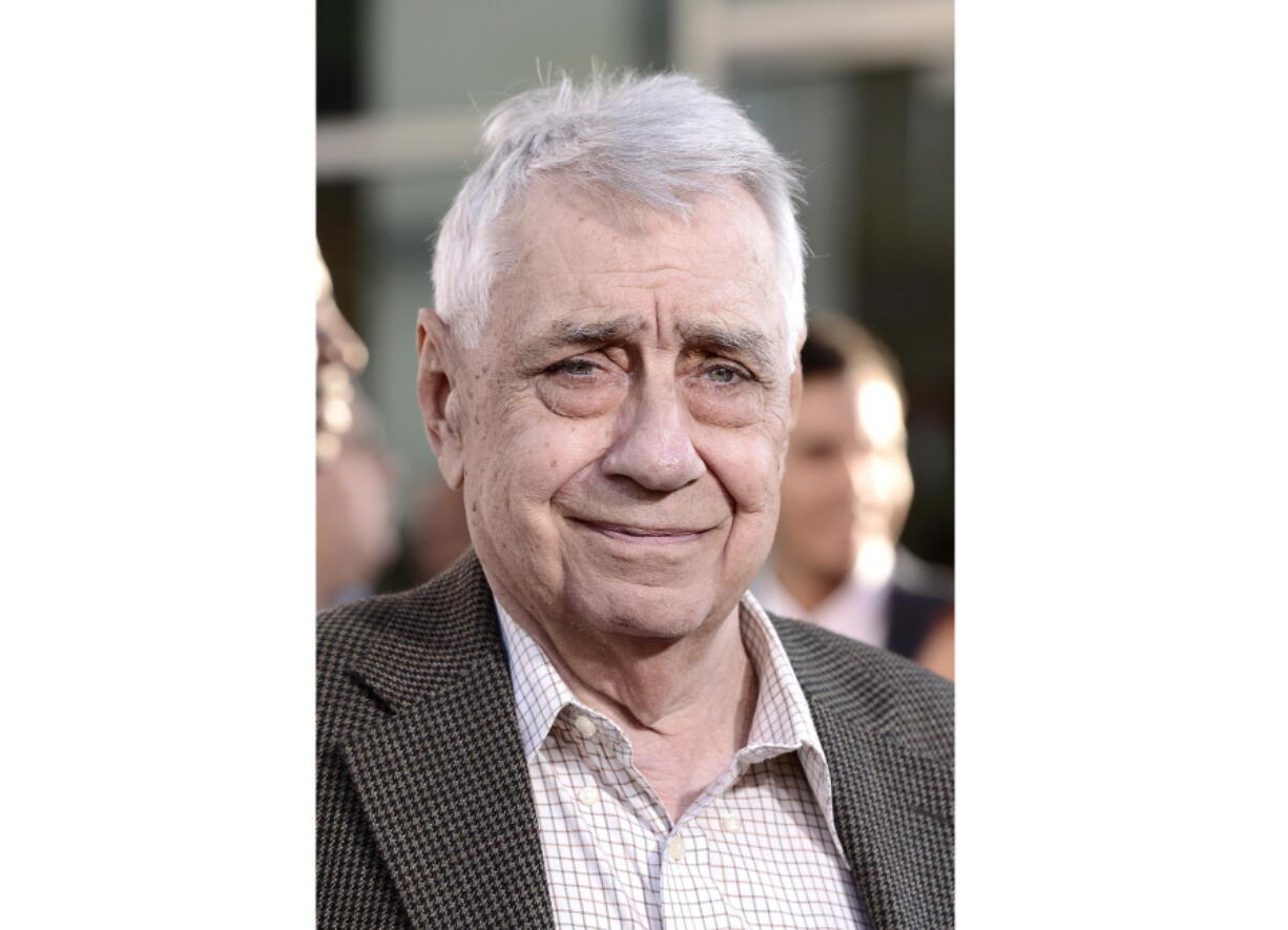 FILE - Philip Baker Hall arrives at the premiere of "Clear History" at the Cinerama Dome on Wednesday, July 31, 2013 in Los Angeles. Hall, the prolific character actor of film and theater who starred in Paul Thomas Anderson's early movies and who memorably hunted down a long-overdue library book in "Seinfeld," has died. He was 90. Holly Wolfle Hall, the actor's wife of nearly 40 years, says Hall died Sunday surrounded by loved ones in Glendale, California.