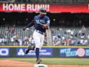 Seattle Mariners' Julio Rodriguez rounds the bases after hitting a two-run home run against the Baltimore Orioles during the fourth inning of a baseball game, Wednesday, June 29, 2022, in Seattle.