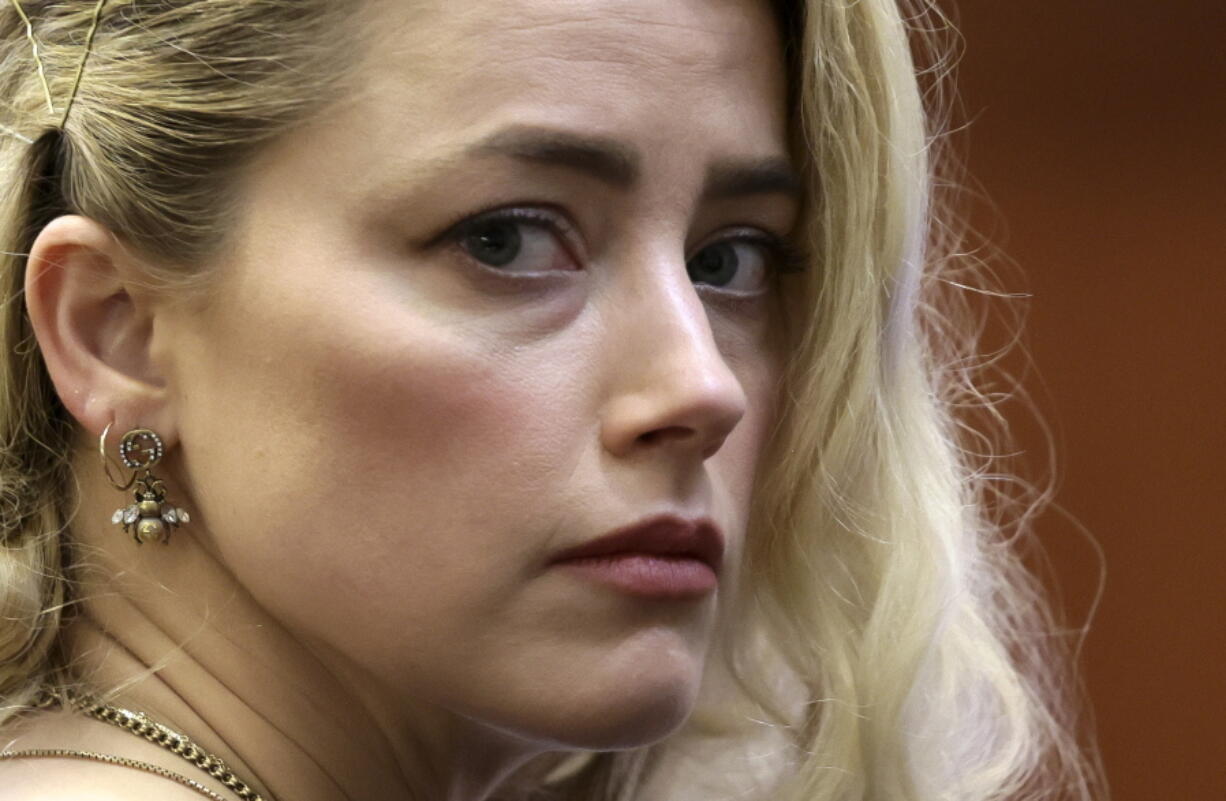 Actor Amber Heard waits before the verdict was read at the Fairfax County Circuit Courthouse in Fairfax, Va, Wednesday, June 1, 2022. The jury awarded Johnny Depp more than $10 million in his libel lawsuit against ex-wife Amber Heard. It vindicates his stance that Heard fabricated claims that she was abused by Depp before and during their brief marriage.