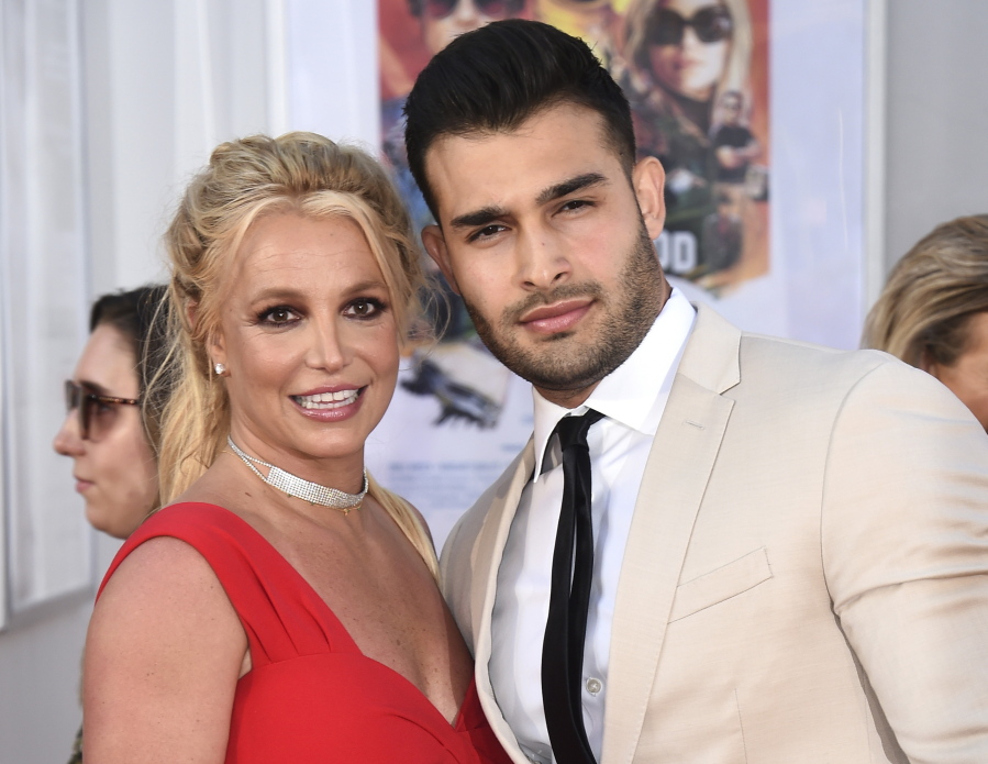 FILE - Britney Spears and Sam Asghari appear at the Los Angeles premiere of "Once Upon a Time in Hollywood" on July 22, 2019. Spears has married her longtime partner Sam Asghari at a Southern California ceremony that came months after the pop superstar won her freedom from a court conservatorship. Asghari's representative Brandon Cohen confirmed the couple's nuptials.