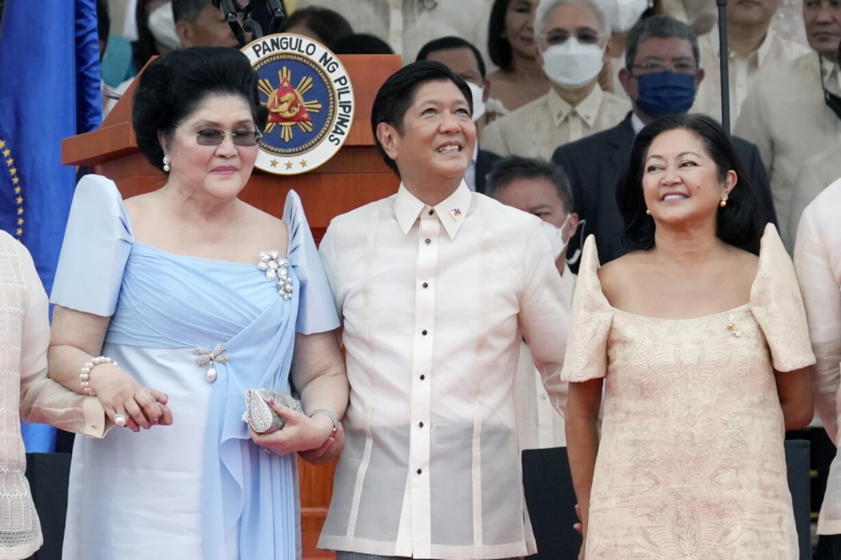 President Ferdinand Marcos Jr. stands with his mother Imelda Marcos, left, and his wife Maria Louise Marcos, right, during the inauguration ceremony at National Museum on Thursday, June 30, 2022 in Manila, Philippines. Marcos was sworn in as the country's 17th president.