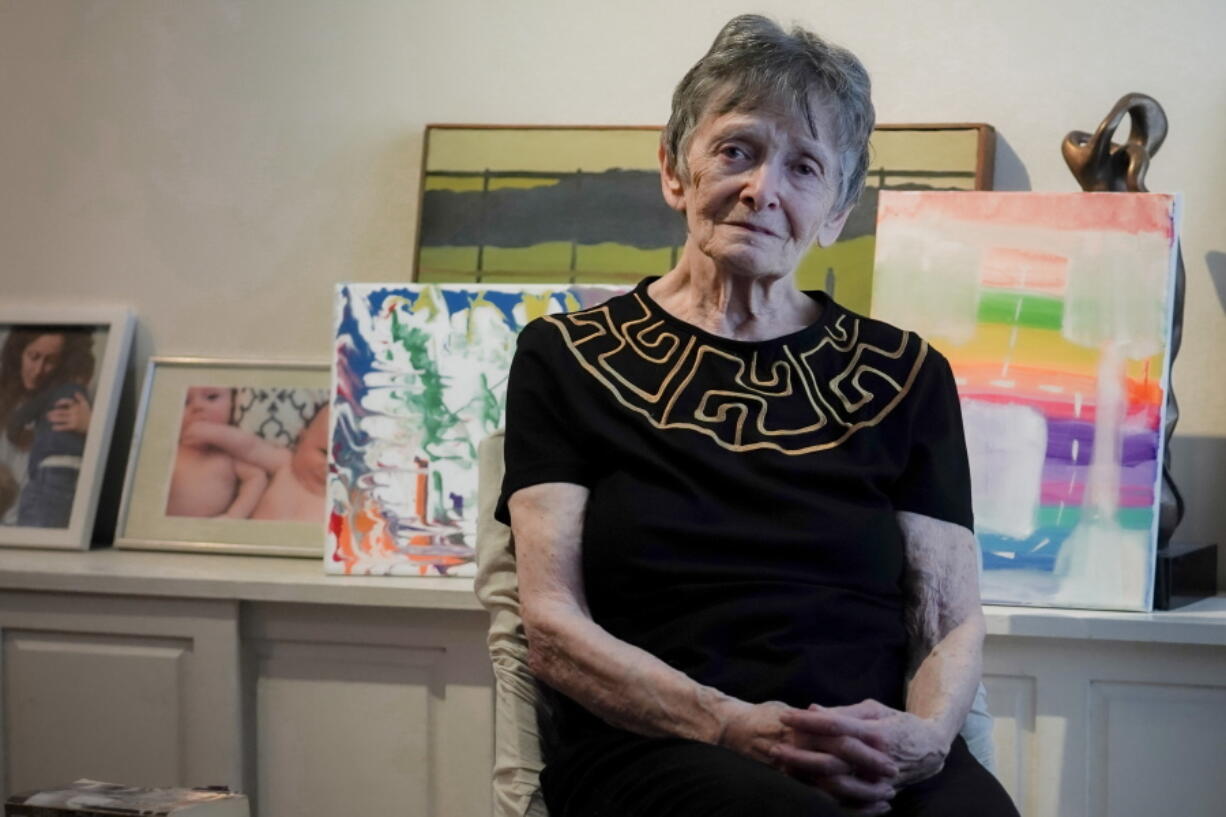 Ellen Ensig-Brodsky, 89, a LGBTQ rights activist, pose in her home, Wednesday, June 22, 2022, in New York. Even with ailing knees, Ensig-Brodsky said she plans to be on the Pride Parade route on Sunday.
