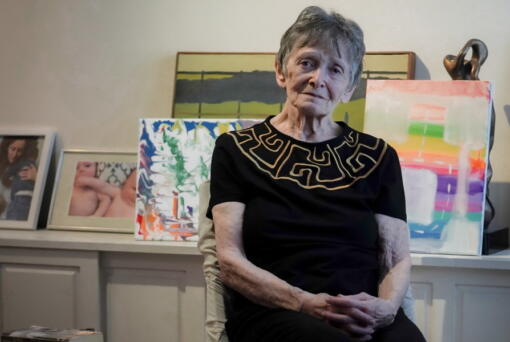Ellen Ensig-Brodsky, 89, a LGBTQ rights activist, pose in her home, Wednesday, June 22, 2022, in New York. Even with ailing knees, Ensig-Brodsky said she plans to be on the Pride Parade route on Sunday.