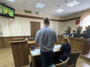 Russian opposition leader Alexei Navalny, seen on the TV screen, appears on a video link from prison provided by the Russian Federal Penitentiary Service in a courtroom in Vladimir, Russia, Tuesday, June 28, 2022. A Russian court has rejected an appeal by imprisoned opposition leader Alexei Navalny, who contended that prison authorities illegally prevented his lawyers from bringing necessary equipment including voice recorders and laptop computers to a court session held in a prison.