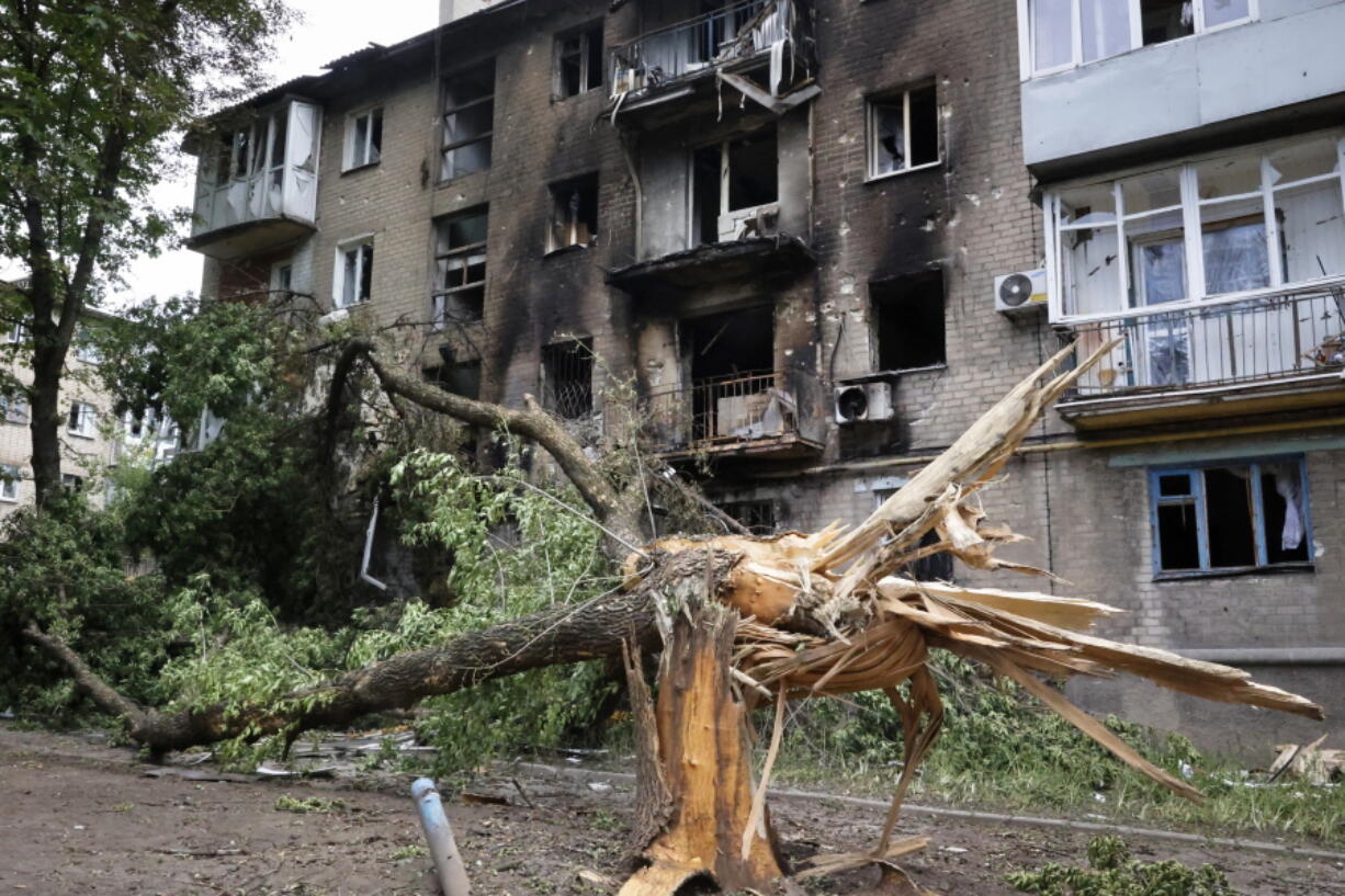 A view of an apartment building damaged during shelling in Donetsk, in territory under the government of the Donetsk People's Republic, eastern Ukraine, Wednesday, June 22, 2022.