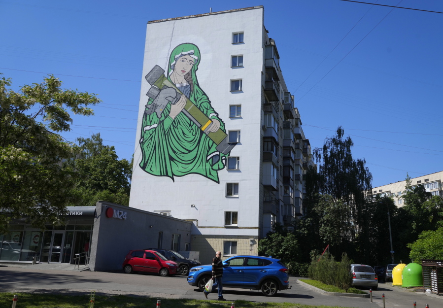 A mural depicts an image known as "Saint Javelina"- Virgin Mary cradling a US-made FGM-148 anti-tank weapon Javelin - on a living house wall in Kyiv, Ukraine, Monday, June 6, 2022. These missiles are among the arms being sent by Western allies to Ukrainian forces to aid in their fight against the Russian invaders.