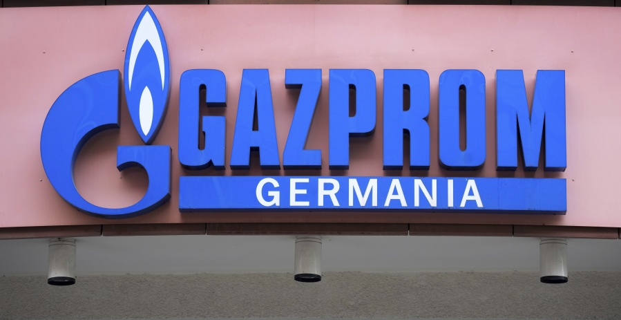 FILE - The logo of 'Gazprom Germania' is pictured at the company's headquarters in Berlin, April 6, 2022. Russian state-controlled energy giant Gazprom says gas deliveries through a key pipeline to Europe will drop by around 40% this year. The dpa news agency reports Tuesday, June 14 that Germany's utility network agency said it didn't see gas supplies as endangered and that reduced amounts through the Nord Stream 1 pipeline under the Baltic Sea aligned with commercial behavior and the previously announced cutoff of gas to Denmark and the Netherlands.
