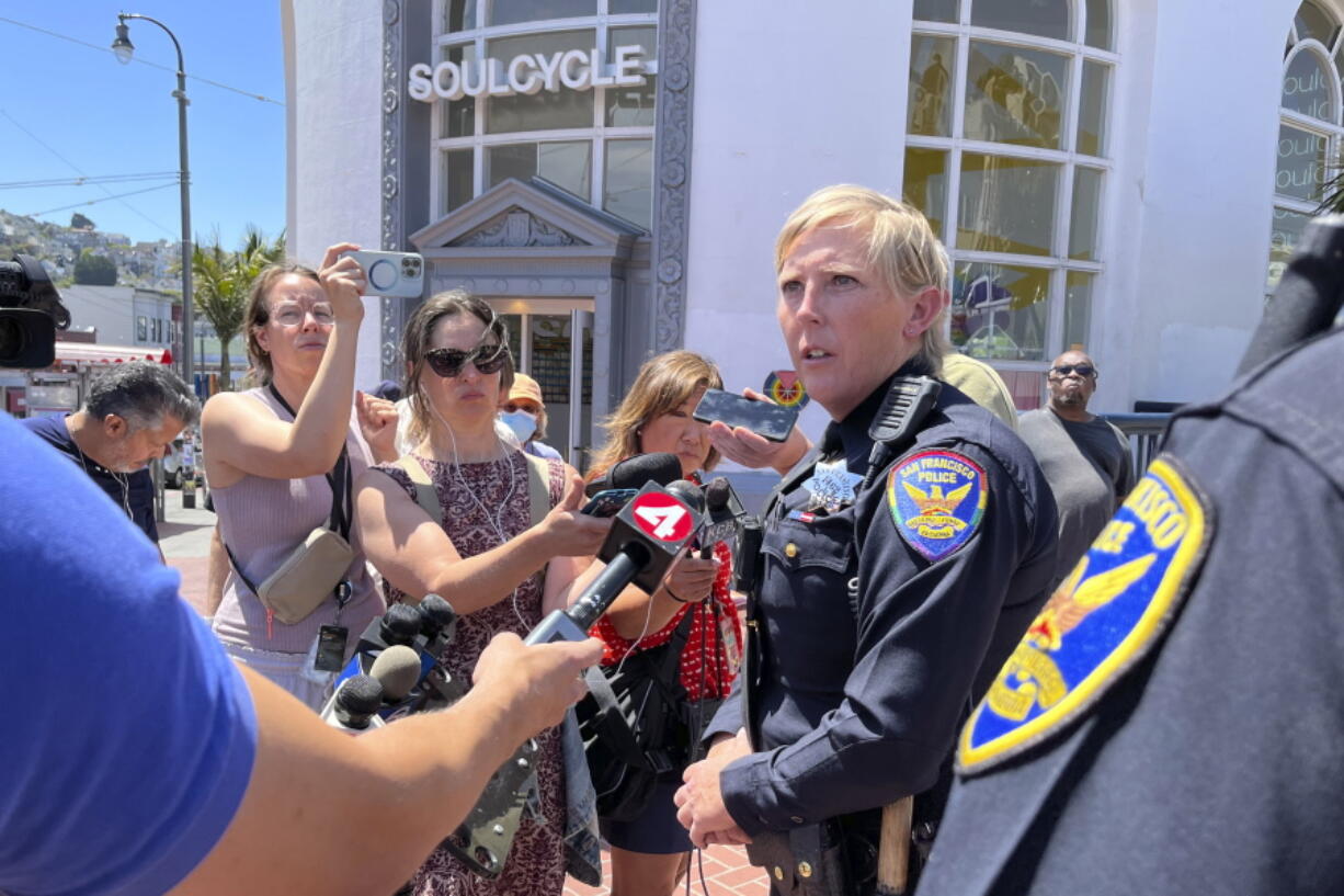 San Francisco Police Officer spokesperson Kathryn Winters speaks with reporters outside the entrance to the Castro Muni station following a shooting in San Francisco, Wednesday, June 22, 2022.