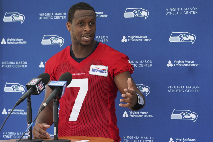 Seattle Seahawks quarterback Geno Smith talks to reporters after NFL football practice Wednesday, June 8, 2022, in Renton, Wash. (AP Photo/Ted S.