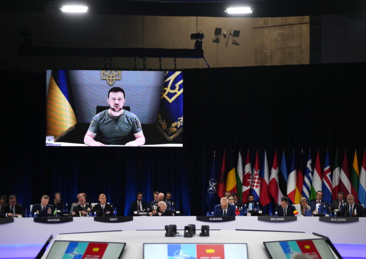 Ukraine's President Volodymyr Zelenskyy addresses leaders via a video screen during a round table meeting at a NATO summit in Madrid, Spain on Wednesday, June 29, 2022. North Atlantic Treaty Organization heads of state meet for a NATO summit in Madrid from Tuesday through Thursday.