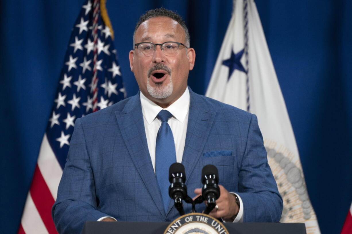 Education Secretary Miguel Cardona speaks at an event where Vice President Kamala Harris announced the cancelation of all federal student loans borrowed by students to attend any Corinthian Colleges, Thursday, June 2, 2022, at the Department of Education in Washington.