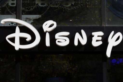 FILE - This Sept. 20, 2017, file photo shows a sign at the Disney store on the Champs Elysees Avenue in Paris, France.  The Supreme Court's decision to end the nation's constitutional protections for abortion has catapulted businesses of all types into the most divisive corner of politics. A rash of iconic names including The Walt Disney Company, Facebook parent Meta, and Goldman Sachs announced they would pay for travel expenses for those who want the procedure but can't get it in the states they live in.