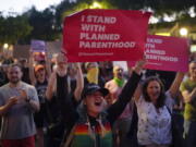 Supporters of abortion rights chant slogans outside a Planned Parenthood clinic during a protest in West Hollywood, Calif., Friday, June 24, 2022. The Supreme Court has ended constitutional protections for abortion that had been in place nearly 50 years in a decision by its conservative majority to overturn Roe v. Wade. (AP Photo/Jae C.
