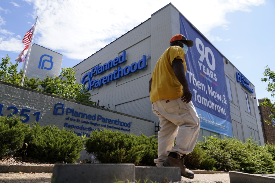 A person walks past Planned Parenthood Friday, June 24, 2022, in St. Louis. Most abortions are now illegal in Missouri following a U.S. Supreme Court decision that ended a constitutional protection for abortion.