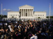 FILE - Protesters fill the street in front of the Supreme Court after the court's decision to overturn Roe v. Wade in Washington, June 24, 2022. Public opinion on abortion is nuanced, but polling shows broad support for Roe and for abortion rights. Seventy percent of U.S. adults said in a May AP-NORC poll that the Supreme Court should leave Roe as is, not overturn it.