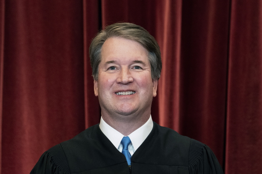FILE - Associate Justice Brett Kavanaugh stands during a group photo at the Supreme Court in Washington, on April 23, 2021.