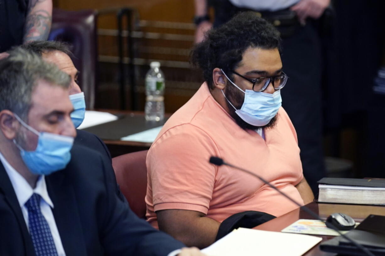 FILE - Richard Rojas, right, appears in court for the start of his trial in New York on May 9, 2022. A prosecutor has told jurors in closing arguments Wednesday, June 15, 2022, that Rojas, accused of using his car to mow down people in Times Square, made a deliberate choice to leave a path of death and destruction in the spring of 2017. An attorney for Rojas countered by calling his client a "lunatic" who was so mentally ill, he didn't know what he was doing that day.
