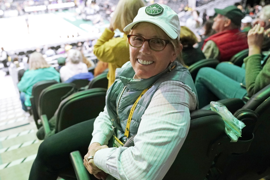Seattle Storm co-owner Ginny Gilder poses for a photo on May 18, 2022, at Climate Pledge Arena during halftime of a WNBA basketball game between the Seattle storm and the Chicago Sky in Seattle. As Title IX marks its 50th anniversary in 2022, Gilder is one of countless women who benefited from the enactment and execution of the law and translated those opportunities into becoming leaders in their professional careers. (AP Photo/Ted S.