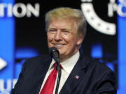 FILE - In this July 24, 2021, file photo former President Donald Trump speaks to supporters at a gathering in Phoenix. The company planning to buy Donald Trump's new social media business disclosed Monday, June 27, 2022 that it has received subpoenas from a grand jury in New York. Shares of Digital World Acquisition Corp. dropped 7% in morning trading Monday as the company reported that the subpoenas and related investigations by the Department of Justice and the Securities and Exchange Commission could delay its acquisition of the maker of Trump's Truth Social app. (AP Photo/Ross D.