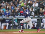 Minnesota Twins' Byron Buxton hits a two-run home run off a pitch from Seattle Mariners starter Chris Flexen during the first inning of a baseball game, Monday, June 13, 2022, in Seattle.