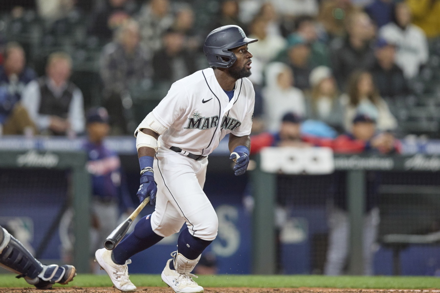 Seattle Mariners' Taylor Trammell hits a solo home run on a pitch from Minnesota Twins' Jharel Cotton during the seventh inning of a baseball game, Monday, June 13, 2022, in Seattle.