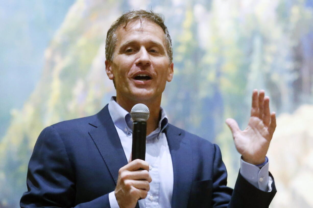 FILE - Former Missouri Gov. Eric Greitens speaks at the Taney County Lincoln Day event at the Chateau on the Lake in Branson, Mo., April 17, 2021.  The video of Greitens, a GOP Missouri U.S. Senate candidate cocking a gun after calling for a hunt of fellow Republicans who he believes are "RINOs," or Republicans In Name Only was scraped off Facebook within a few hours Monday, June 20, 2022. It remains live, however, on YouTube. You can also still see the video on Twitter, but you can't retweet it.