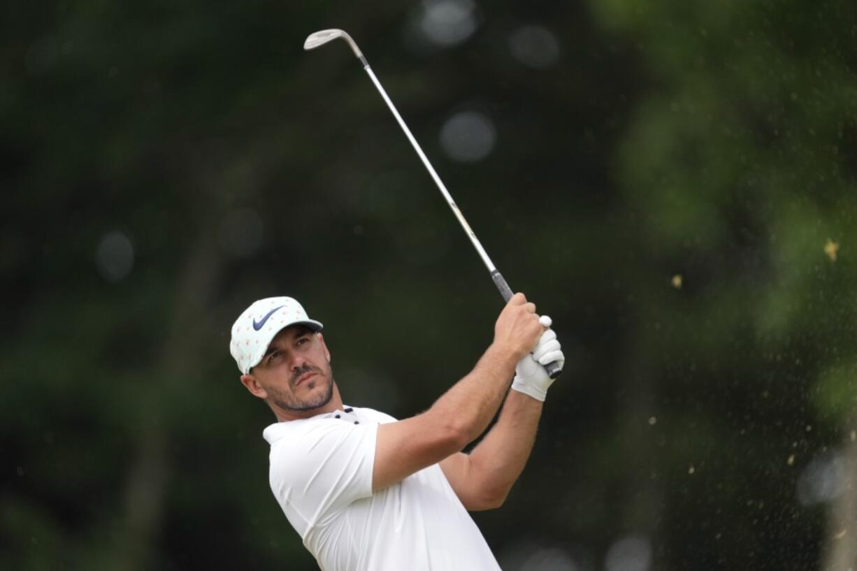 Brooks Koepka watches his shot on the 11th hole during the second round of the U.S. Open golf tournament at The Country Club, Friday, June 17, 2022, in Brookline, Mass. (AP Photo/Robert F.