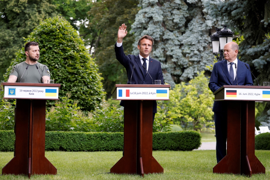 From left, Ukraine President Volodymyr Zelenskyy, France's President Emmanuel Macron and German Chancellor Olaf Scholz attend a press conference in Kyiv, Thursday, June 16, 2022. The leaders of four European Union nations visited Ukraine on Thursday, vowing to back Kyiv's bid to become an official candidate to join the bloc in a high-profile show of support for the country fending off a Russian invasion.