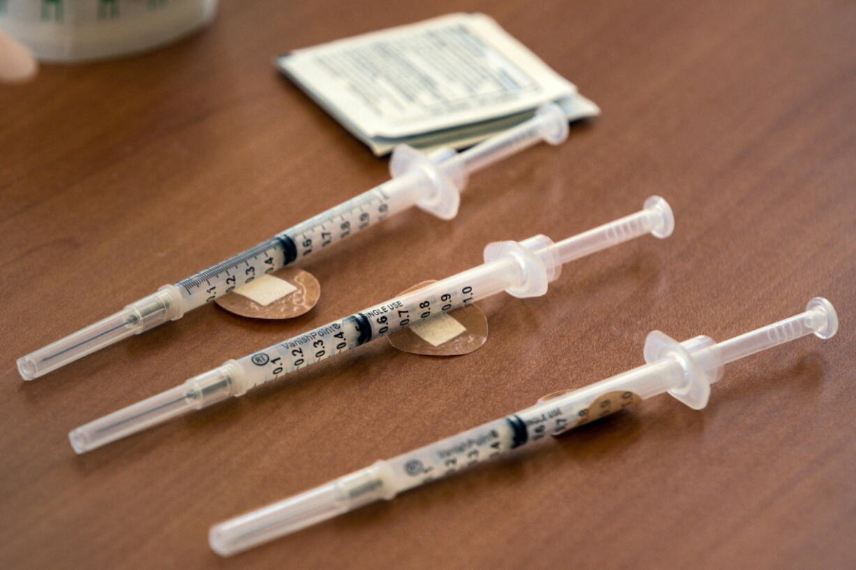 FILE - Doses of the Moderna COVID-19 vaccine wait to be administered during a vaccination clinic in Odessa, Texas, on Tuesday, Aug. 24, 2021. On Thursday, June 23, 2022, an expert panel is recommending Moderna's COVID-19 shots for kids ages 6 to 17, marking another step toward bringing a second brand of vaccine for kids in that age group.