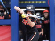 Oregon State's Savanah Whatley hits against Florida during the second inning of an NCAA softball Women's College World Series game Thursday, June 2, 2022, in Oklahoma City.