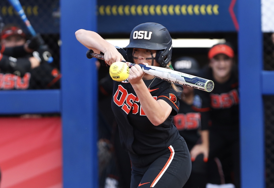 Oregon State's Savanah Whatley hits against Florida during the second inning of an NCAA softball Women's College World Series game Thursday, June 2, 2022, in Oklahoma City.