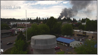 Smoke from a house fire at 8500 block of 80th Avenue is seen Thursday afternoon on a traffic camera.