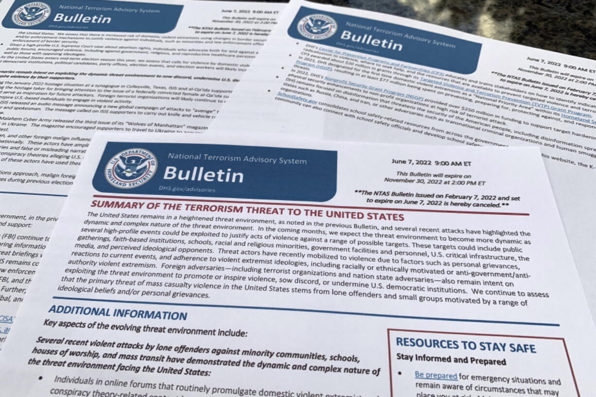 The bulletin issued by the Department of Homeland Security, outlining the current terrorism threat to the United States, is photographed Thursday, June 9, 2022. DHS warned June 7 that skewed framing of the subjects like abortion, guns, immigration and LGTBQ rights, could drive extremists to violently attack pubic places across the U.S. in the coming months.